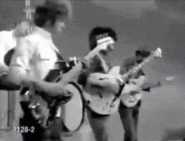 a black and white photo of a band with the number 1128-2 in the corner