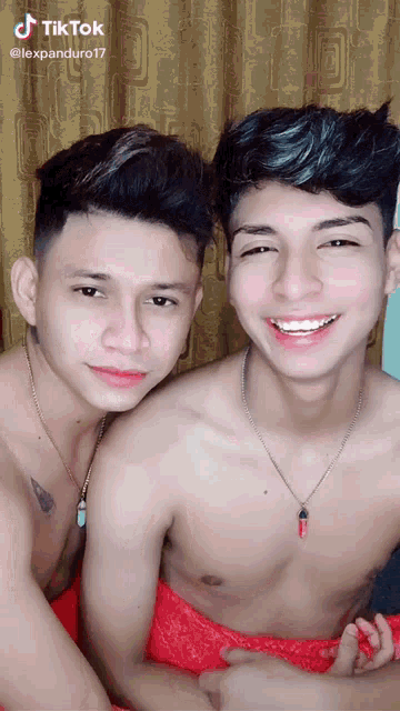 two shirtless men are posing for a picture and the caption reads tiktok @lexpanduro17