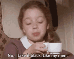 a young girl is holding a cup of coffee and saying `` no , i take it black . like my men . ''