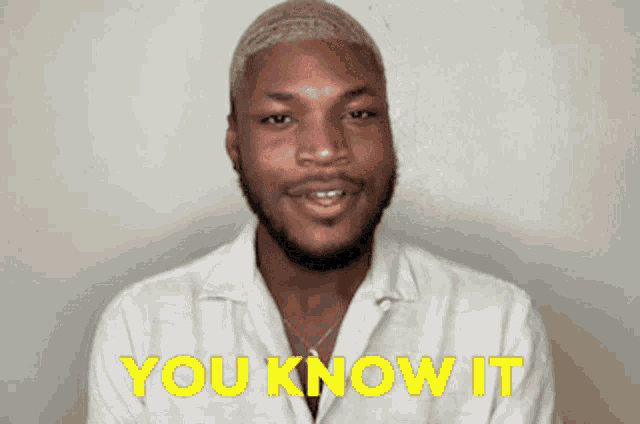 a man in a white shirt with the words you know it behind him