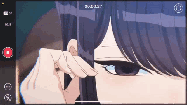 a video of a girl is being recorded at 00 : 00 : 27