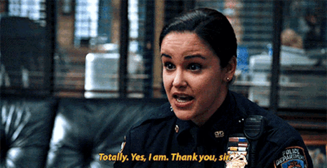 a woman in a police uniform says " totally yes i am thank you "
