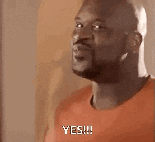 a man with a beard is making a funny face and saying `` yes '' .