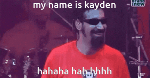 a man wearing sunglasses and a red shirt says " my name is kayden "