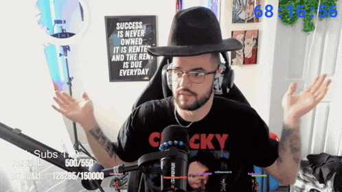 a man wearing a hat and a shirt that says cocky on it