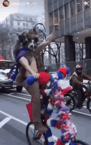 a man in a bear costume is riding a bike with a clown on the back