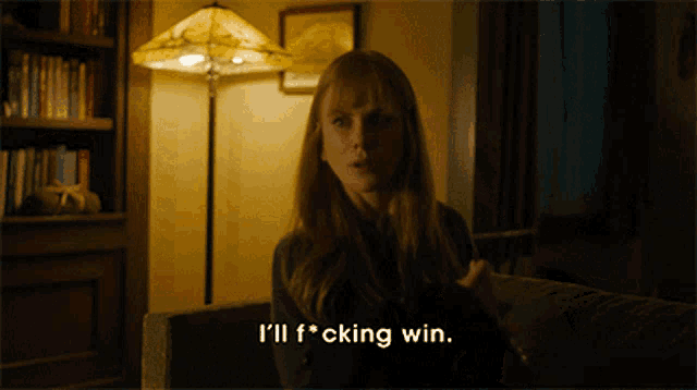a woman sitting on a couch with the words i 'll f * cking win