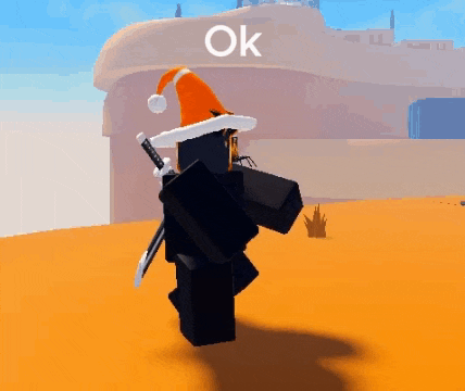 a ninja wearing a santa hat and a sword is standing in front of a building with the word ok on it .