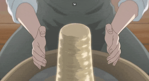 a person is making a cylinder with their hands in a circle