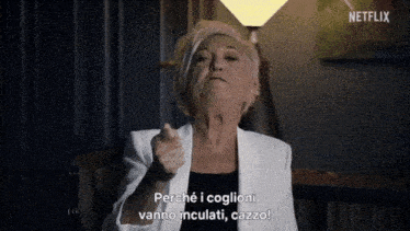 a woman in a white jacket is pointing at the camera in a netflix ad .