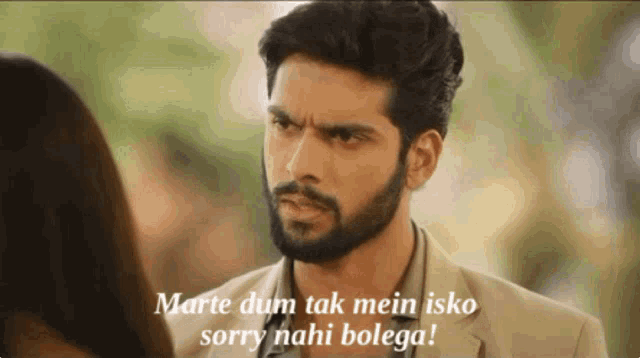 a man with a beard is talking to a woman with the words " marte dum tak mein isko sorry nahi bolega "