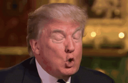 a close up of donald trump making a funny face with his mouth open