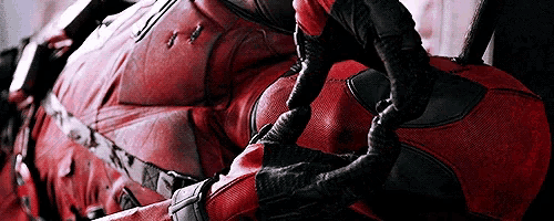 a close up of a person wearing a superhero costume
