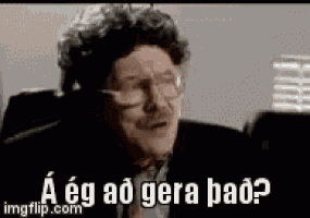 a man wearing glasses and a suit is making a funny face and says `` a eg ao gera bad ? ''