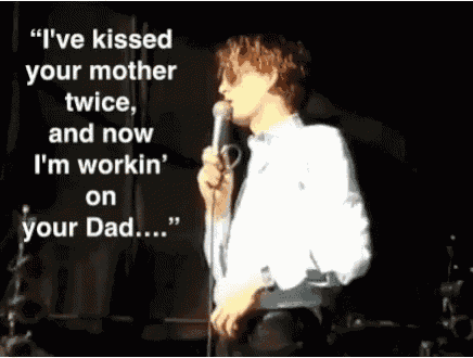 a man singing into a microphone with the words i 've kissed your mother