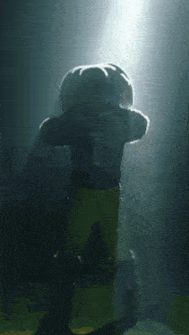 a football player with the number 1 on his jersey stands in the dark