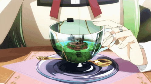 a person is holding a cup of tea with a small island inside