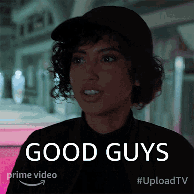 a woman wearing a hat says good guys on a poster