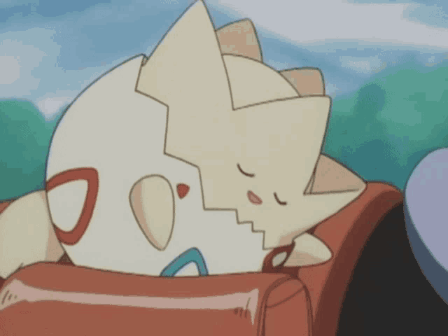 a cartoon character is sleeping on a couch with its eyes closed