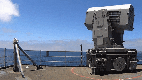 a large machine with the number 9 on it sits on the deck of a ship