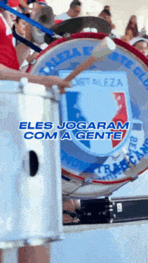 a person playing a drum with the words eles jogaram com a gente