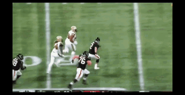 a football player with the number 76 on his jersey runs on the field
