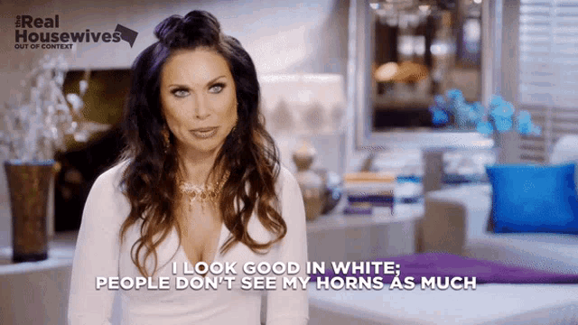 a woman says i look good in white and people don 't see my horns as much