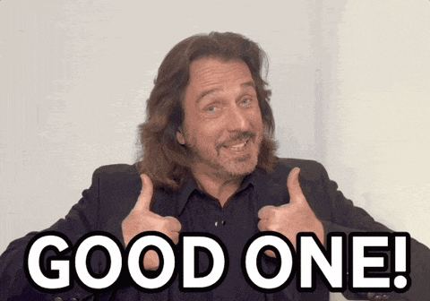 a man with long hair and a beard giving a thumbs up with the words good one behind him