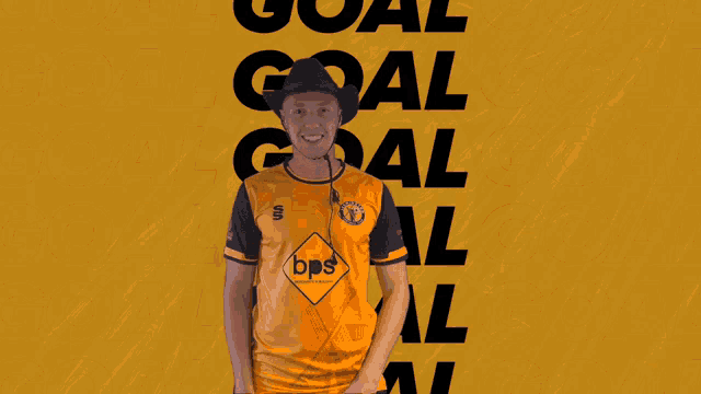 a man wearing a cowboy hat is covering his face in front of a yellow background that says goal goal goal goal