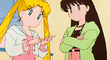 two anime girls are standing next to each other with their arms crossed and talking .