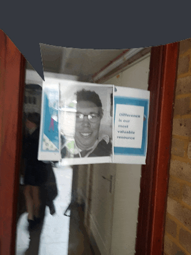 a picture of a man with glasses is behind a sign that says " a difference between your most valuable resource "