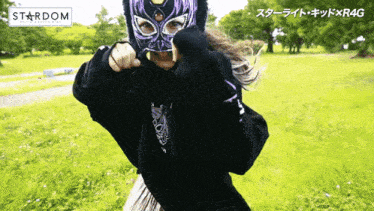 a person wearing a mask with stardom written on the bottom