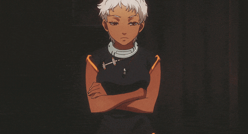 a girl with white hair is standing with her arms crossed in a dark room