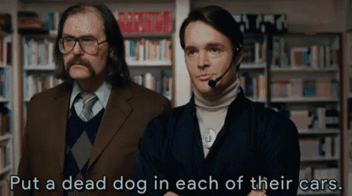 two men standing next to each other with the words put a dead dog in each of their cars written below them
