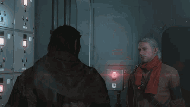 a man in a red scarf stands next to another man