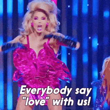 a woman in a pink dress says everybody say " love " with us