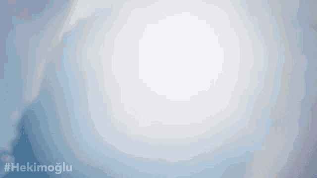 the sun is shining through the clouds and the hashtag #hekimoglu is below it