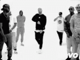 a group of men are standing next to each other on a white background in a black and white photo .