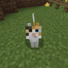 a calico cat in a minecraft game is standing in the grass