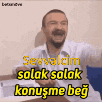 a man with a beard is laughing with the words sevvalcim salak salak konuşme beg behind him