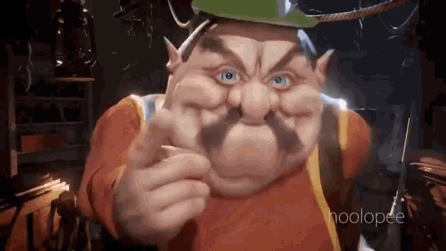 a cartoon character with a mustache and hat is pointing at the camera .