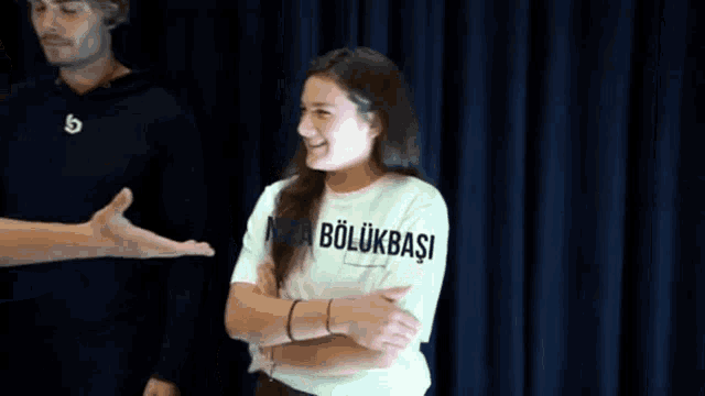 a woman wearing a t-shirt that says " bolukbasi "