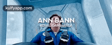 a poster for ann bann shows a man in a blue suit