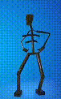 a statue of a skeleton against a blue sky