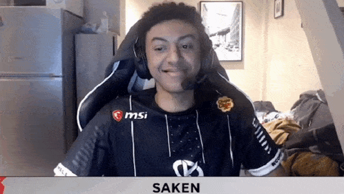 a man wearing headphones and a shirt that says msi on it