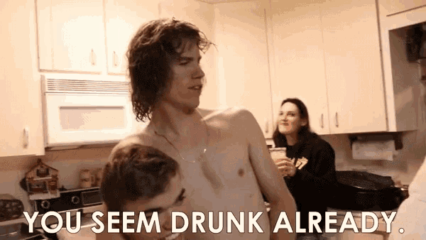 a shirtless man in a kitchen with the words you seem drunk already below him