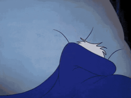 a cartoon of donald duck laying in bed with a blue blanket