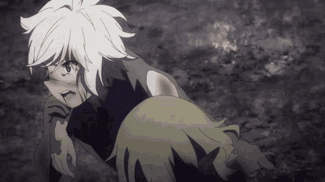 a girl with white hair is laying on the ground with another girl