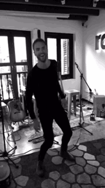 a black and white photo of a man dancing