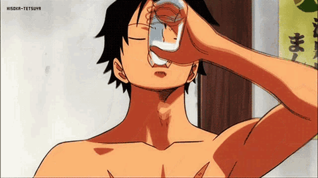 a man without a shirt is drinking from a glass with his eyes closed